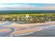 Aerial view of beachfront property with expansive ocean views and lush greenery at 63 Lost Village Trl, Edisto Island, SC 29438