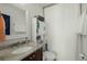 Bathroom with shower, granite countertop, and storage cabinet at 712 S Shelmore Blvd # 15, Mount Pleasant, SC 29464