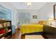 Bedroom with yellow comforter and hardwood floors at 712 S Shelmore Blvd # 15, Mount Pleasant, SC 29464