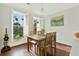 Bright dining area with wood table and hardwood floors at 712 S Shelmore Blvd # 15, Mount Pleasant, SC 29464