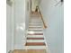 Elegant wooden staircase connecting floors of home at 712 S Shelmore Blvd # 15, Mount Pleasant, SC 29464