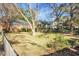 Large backyard with wooden fence and mature trees at 917 S Main St, Summerville, SC 29483