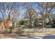 Backyard with wooden fence and mature trees at 917 S Main St, Summerville, SC 29483