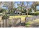 Backyard with wooden fence, gate, and detached building at 917 S Main St, Summerville, SC 29483