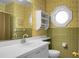 Bathroom with palm tree wallpaper, green tile, and vanity at 917 S Main St, Summerville, SC 29483