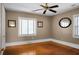 Bedroom with hardwood floors, ceiling fan and window at 917 S Main St, Summerville, SC 29483