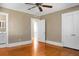 Bedroom with hardwood floors, ceiling fan and access to bathroom at 917 S Main St, Summerville, SC 29483