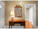 Entryway with hardwood floors, a console table and mirror at 917 S Main St, Summerville, SC 29483