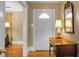 Bright entryway with hardwood floors, a console table, and a mirror at 917 S Main St, Summerville, SC 29483