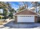 Detached garage with white door and brick exterior at 917 S Main St, Summerville, SC 29483