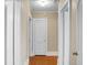 Long hallway with hardwood floors and neutral walls at 917 S Main St, Summerville, SC 29483