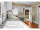 Kitchen features a double sink and access to a sunroom at 917 S Main St, Summerville, SC 29483