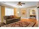 Living room with hardwood floors, a sofa and area rug at 917 S Main St, Summerville, SC 29483