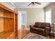 Living room with wood floors, bookcase, and leather couch at 917 S Main St, Summerville, SC 29483