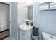 Clean bathroom, featuring a white vanity, mirror, and updated fixtures at 9772 Berrywood Dr, Ladson, SC 29456