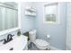 Well-lit bathroom with toilet, sink, and shower/tub combo at 9772 Berrywood Dr, Ladson, SC 29456