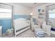 Charming Bedroom with crib, glider, and plenty of storage at 9772 Berrywood Dr, Ladson, SC 29456
