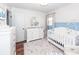 Bedroom featuring white furniture and calming blue accents at 9772 Berrywood Dr, Ladson, SC 29456
