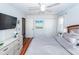 Spacious bedroom with large TV, dresser, and comfortable bed at 9772 Berrywood Dr, Ladson, SC 29456