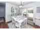 Bright dining area with white table and chairs, and view to backyard at 9772 Berrywood Dr, Ladson, SC 29456