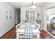 Bright dining area with white table, chairs, and shiplap walls at 9772 Berrywood Dr, Ladson, SC 29456
