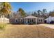 Brick ranch house with a covered porch and well-maintained lawn at 9772 Berrywood Dr, Ladson, SC 29456
