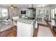 Open concept kitchen with island seating and stainless steel appliances at 9772 Berrywood Dr, Ladson, SC 29456