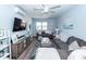 Spacious living room with comfortable sofas and large TV at 9772 Berrywood Dr, Ladson, SC 29456