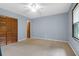 Bedroom with light grey walls and wood louvered doors at 1088 Quiet Rd, Mount Pleasant, SC 29464