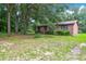 Brick ranch house nestled among large trees at 1088 Quiet Rd, Mount Pleasant, SC 29464