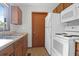 Galley kitchen with wood cabinets and white appliances at 1088 Quiet Rd, Mount Pleasant, SC 29464