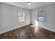 Bright bedroom with hardwood floors and two windows at 1104 Berkeley St, Hanahan, SC 29410