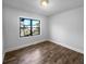 Bedroom with hardwood floors, large window, and neutral walls at 1104 Berkeley St, Hanahan, SC 29410