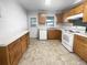 Updated kitchen featuring wood cabinets and white appliances at 1104 Berkeley St, Hanahan, SC 29410