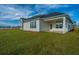 Spacious backyard with a home and grassy area at 115 Crosscut Ln, Summerville, SC 29486