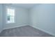 Simple bedroom with grey carpet and a window at 115 Crosscut Ln, Summerville, SC 29486