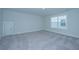Spacious bedroom with grey carpet and window at 115 Crosscut Ln, Summerville, SC 29486