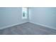 Simple bedroom with grey carpet and a window at 115 Crosscut Ln, Summerville, SC 29486