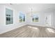 Breakfast nook with hardwood floors, chandelier and access to backyard at 115 Crosscut Ln, Summerville, SC 29486