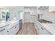Modern kitchen with farmhouse sink, stainless steel appliances, and granite countertops at 115 Crosscut Ln, Summerville, SC 29486