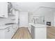Modern kitchen with white cabinets, granite countertops and stainless steel appliances at 115 Crosscut Ln, Summerville, SC 29486