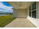 Covered patio overlooking a pond and grassy backyard at 115 Crosscut Ln, Summerville, SC 29486
