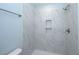 Modern shower with marble-tiled walls and built-in shelves at 115 Crosscut Ln, Summerville, SC 29486
