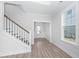 Bright entryway with hardwood floors and a staircase leading upstairs at 115 Crosscut Ln, Summerville, SC 29486
