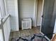 Small balcony with white railing, storage cabinet, and rug at 1300 Park West Blvd # 110, Mount Pleasant, SC 29466