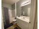 Bathroom with white vanity, shower/tub combo, and neutral decor at 1300 Park West Blvd # 110, Mount Pleasant, SC 29466