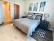 Bedroom with gray bedding and large rug at 1300 Park West Blvd # 110, Mount Pleasant, SC 29466