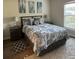 Bedroom with gray bed, nightstands, and large window at 1300 Park West Blvd # 110, Mount Pleasant, SC 29466