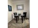 Bright dining area with glass table, two black chairs, and stylish rug at 1300 Park West Blvd # 110, Mount Pleasant, SC 29466