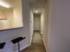 Bright hallway with hardwood floors and neutral walls at 1300 Park West Blvd # 110, Mount Pleasant, SC 29466